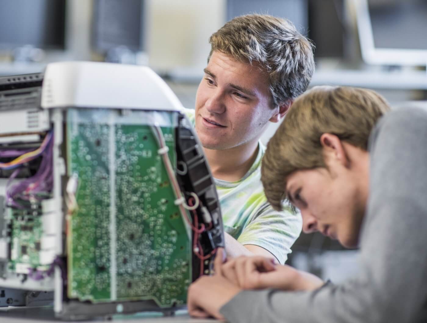 Students working on computer electronics