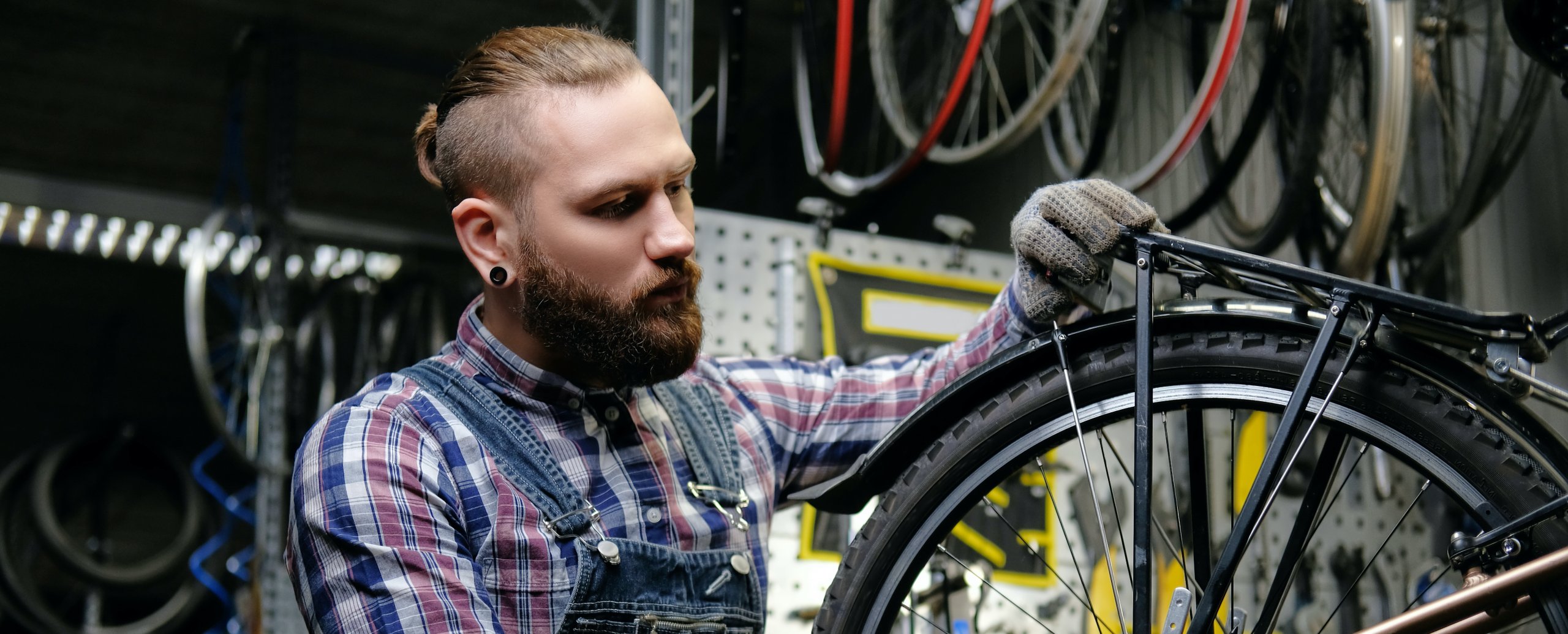 Man working on a bicycle in a bike shop